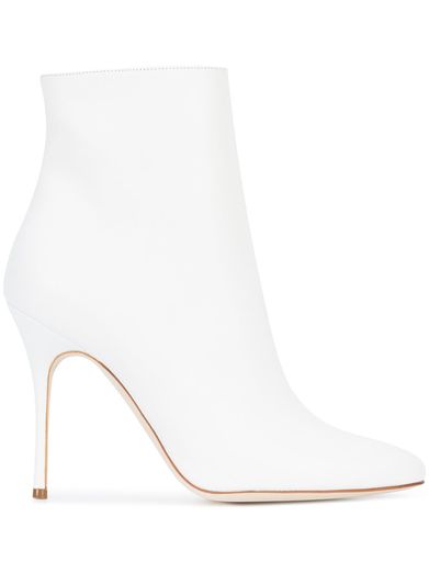 Legendary Spanish footwear designer Manolo Blahnik redefines classic femininity with his fashion-forward silhouettes, which blend experimental design with timeless elegance. Expertly crafted in Italy from smooth white leather, these sleek 'Insopo' ankle boots from the label's AW17 collection feature a high 110mm stiletto heel, a side zip fastening, a softly pointed toe and a branded insole. In White. To buy click to link