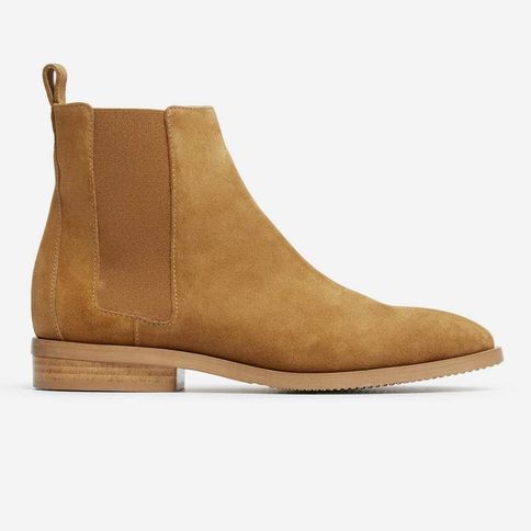 Our Chelsea Boot gets a modern revamp. Details like a leather heel tab and squared elastic panels offer a modern look and pull-on ease. It also features a ¾” stacked leather heel, textured sole, and rubber heel for durability. Pair with straight legged or skinny jeans. In Mustard Suede.