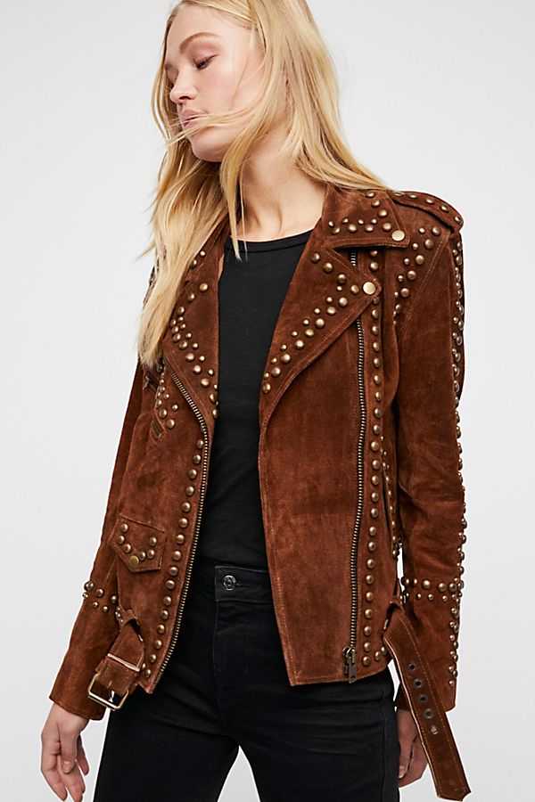 Woman wearing studded suede jacket